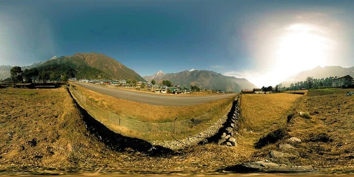LUKLA, NEPAL - 1 DECEMBER 2017: 360 VR Aircraft from Kathmandu arrives to airport. Wild Himalayas high altitude nature and mount valley. Rocky slopes covered with trees. Trekking area to the base camp
