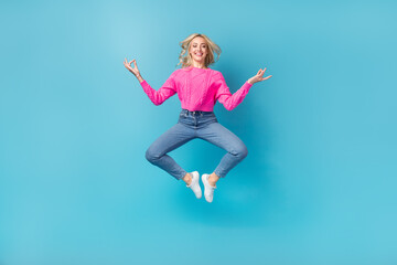 Full body photo of young relaxed closed eyes woman jumping balance asana meditation concentrated herself isolated on blue color background