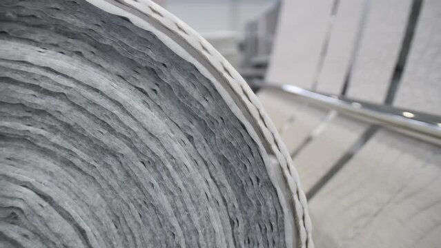 Textile factory. spinning of the fabric roll.  A large warehouse of textile products and goods. Sewing or furniture production.