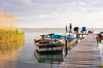 Family vacation at Lake Balaton, Fishing together, Boats, Setting sun, Hungary, Lake Balaton