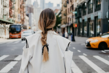 girl with French braids and chanel lace bow in streets of new York soho little paris white elegant modern pinterest style inspo trendy  - obrazy, fototapety, plakaty