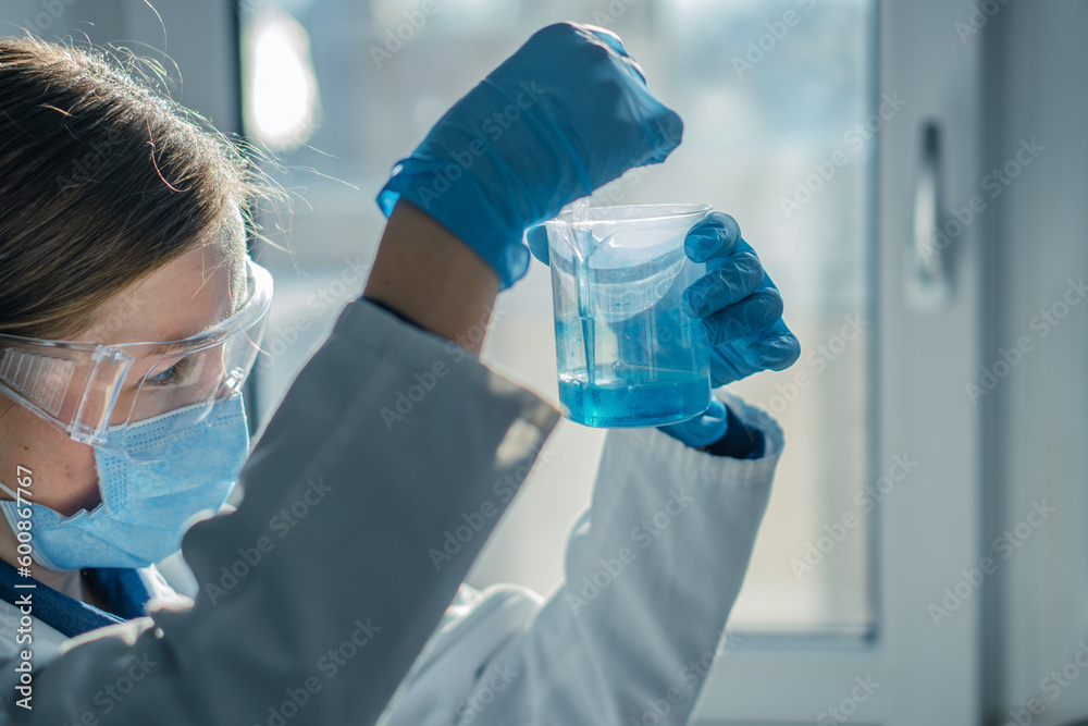 Poster the photo shows a scientist in a biotechnological laboratory conducting research in the field of med