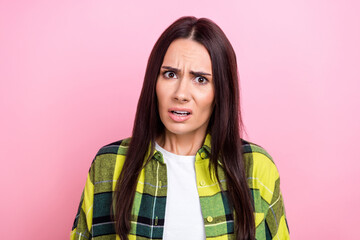 Photo of suspicious angry woman dressed plaid shirt looking you isolated pink color background