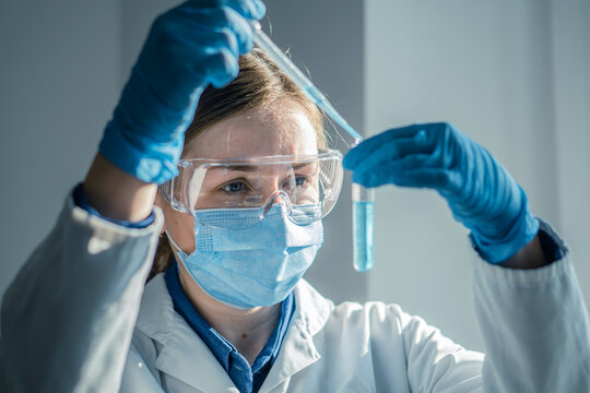 Photo shows chemist working on new technologies in a medical laboratory to improve diagnosis and treatment of diseases. Experiment in biological laboratory to determine effectiveness new medication.
