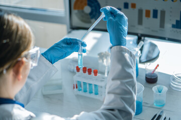 Experiment in chemical laboratory to develop new drugs to treat cardiovascular disease. Scientist...
