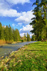 Beautiful spring panorama over river to snowy Witow, Tatra mountains, Poland