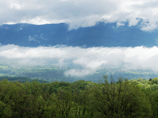 Morning clouds and mist in Valromey-sur-Seran valley, spring in Ain, France