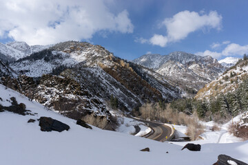 Snow covered mountains along highway leading up to ski resorts outside of Salt Lake City, Utah
