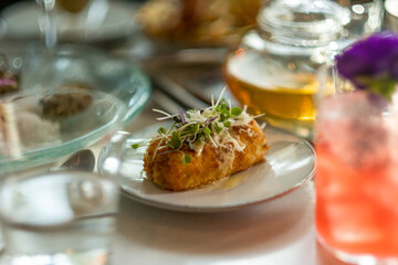 Afternoon Croquette on a fancy plate, White table cloth dining