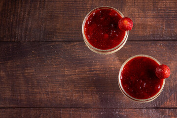 Dessert of creamy pudding and strawberry jam. Panna cotta. - obrazy, fototapety, plakaty