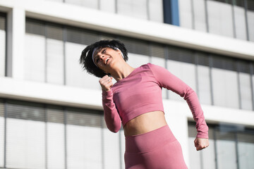 Young fitness woman wearing sportswear standing