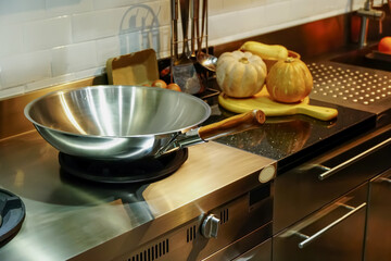 New cast iron pan on gas stove in modern kitchen.                      