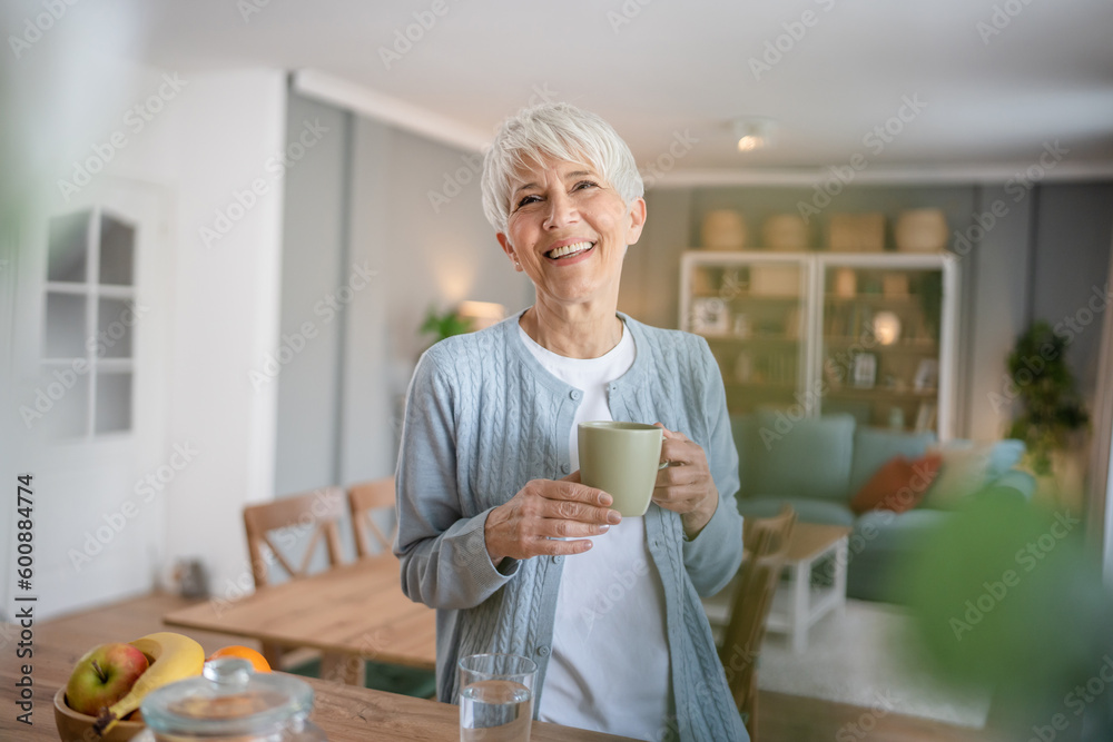 Wall mural Close up portrait of one senior woman with short hair happy smile