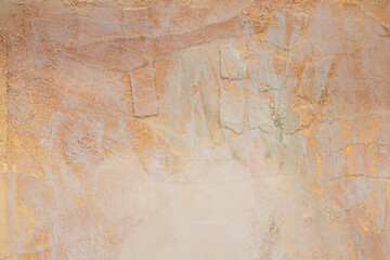 Grunge crumpled paper texture painting wall. Abstract gold, bronze and beige marble copy space background.