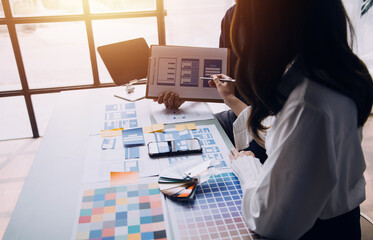 Close up ux developer and ui designer brainstorming about mobile app interface wireframe design on...