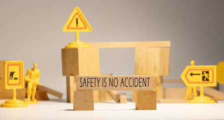 Safety is no accident. Written on wooden surface.