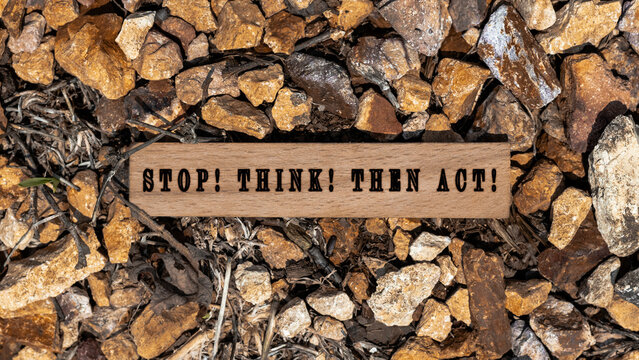 Stop Think Then act Written on wooden surface.