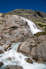 small waterfall of a mountain creek at Grimselpass