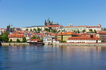 Naklejka na ściany i meble Spring colorful Prague Lesser Town with gothic Castle above River Vltava in the sunny Day, Czech Republic