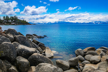 View of Lake Tahoe from granite boulder beach, looking to the California South side from the...