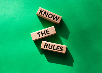 Know the rules symbol. Wooden blocks with words Know the rules. Beautiful green background. Business and Know the rules concept. Copy space.