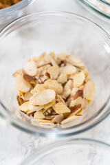 Lemon poppy seed muffins garnished with almond slivers