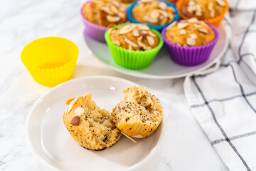 Lemon poppy seed muffins garnished with almond slivers