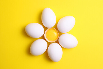 fresh farm chicken eggs on a colored background