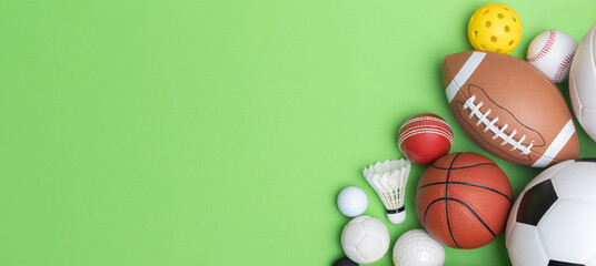 Sports equipment, balls on green background. Horizontal education and sport poster, greeting cards, headers, website.