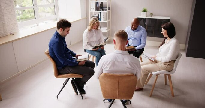 Group Of People Sitting On Chair