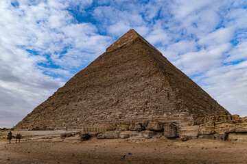 Pyramids of giza during a sunny day, with the desert in the foreground, Cairo, Egypt.
