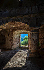 Light entering through door of old abandoned Catholic church. Nyrkiv, Ukraine