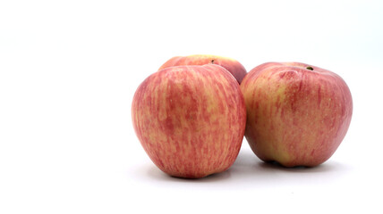closeup of a group of beautiful ripe red apples on a white background