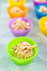 Lemon poppy seed muffins garnished with almond slivers