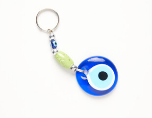 Flatlay close up picture of Turkish Evil Eye on white background.