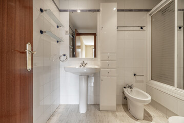 Naklejka na ściany i meble A complete bathroom with showers with screens, white column furniture