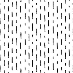 Vertical stripes seamless pattern. Brush drawn dashed parallel short lines in grunge style. Rain or tech motif. Vector black brush strokes. Stylish monochrome striped texture. Abstract background.