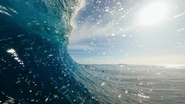 POV of Surfer in the Barrel, View from inside the tube of surfer riding perfect blue ocean wave
