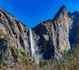 Yosemite NP, CA, USA - March 29, 2022:  Majestic views of granite formations, waterfalls, lakes and streams located within this popular destination.