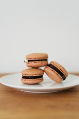 isolated closeup of stacked macarons on a plate