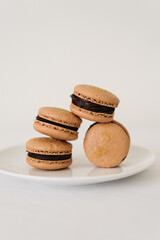 artistic macarons stacked on a plate