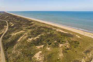 Fototapeta na wymiar Panoramic view over sand dune along the Dutch North Sea coast, Netherlands . High quality photo