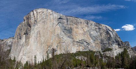 Fototapeta na wymiar Yosemite NP, CA, USA - March 29, 2022: Majestic views of granite formations, waterfalls, lakes and streams located within this popular destination.