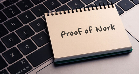 There is notebook with the word Proof of Work.It is as an eye-catching image.