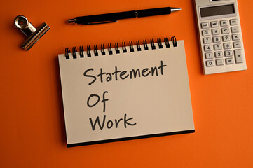 There is notebook with the word Statement Of Work. It is as an eye-catching image.