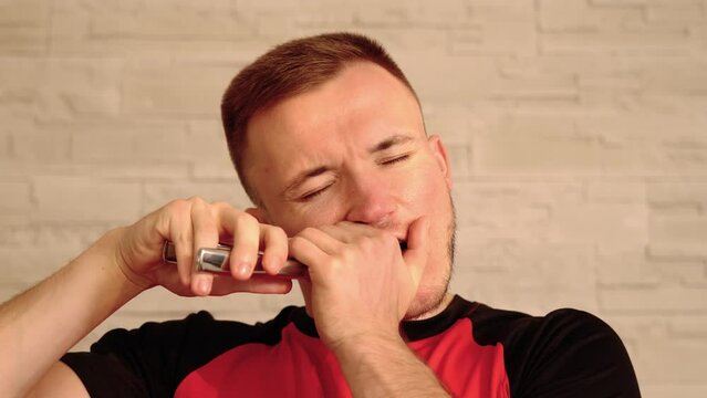 Serious man shows nutcracker and performs taking out tooth