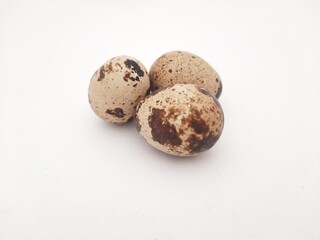 Obraz premium three quail eggs isolated on white background