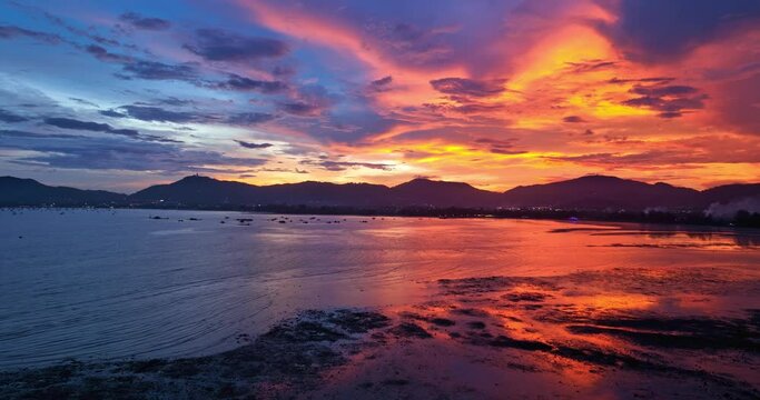 
aerial view reflection of colorful cloud in bright sky of sunset above the ocean at Khao Khad Phuket. 
Majestic sunset or sunrise landscape Amazing light of nature background. 
fantastic sky texture.