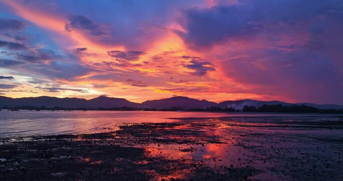 
aerial view reflection of colorful cloud in bright sky of sunset above the ocean at Khao Khad Phuket. 
Majestic sunset or sunrise landscape Amazing light of nature background. 
fantastic sky texture.