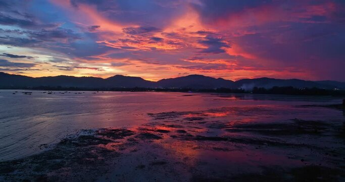 
aerial view reflection of colorful cloud in bright sky of sunset above the ocean at Khao Khad Phuket. 
Majestic sunset or sunrise landscape Amazing light of nature background. 
fantastic sky texture.